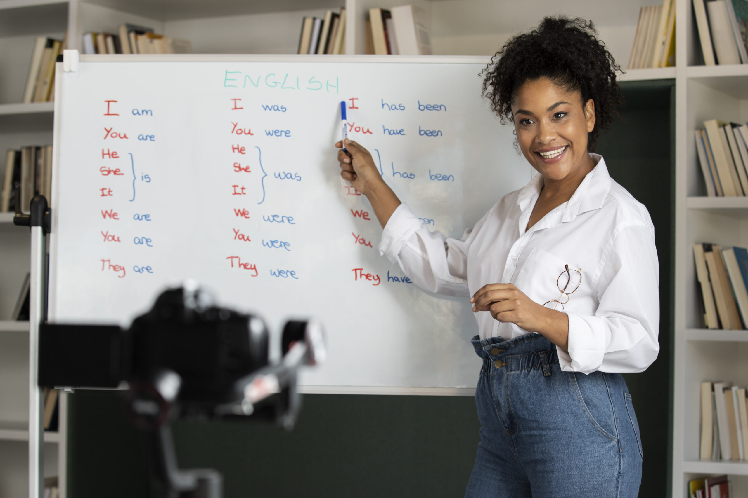 medium-shot-smiley-woman-with-white-board